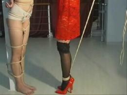 Tie up and hanging Two girls are tied up and hanging on the wall