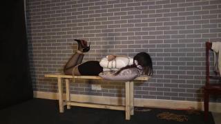 Extremely tight hogtie on Chinese girl .