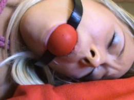 Phoxy in the Long Dress Foxy is hogtied wearing a long dress, tights, and high-heels. She is tied really well but is missing rope below the knees. She enjoys a large, red ball gag. She struggles a lot. found on kinbakublogger.blogspot.kr
