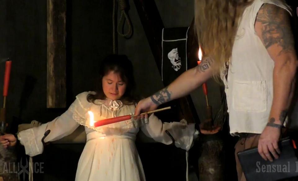 Heretic Accused Heretic Accused<br>http://www.sensualpain.com/sadomasochism/trailer.php?y=2018&p=04_01tdagger4&u=SensualPain-Tess-Dagger-Heretic-Accused<br>Tribunal Inquiries Aboard Ship... God’s time is not our time, as The Truth is sought, even at sea, without shore under foot...The accused will be sentenced to further questioning to obtain the "truth". At the timbers of peril, she will be kept aloft in a chain enclosure with iron bra and heretic spike in place. On this God’s morn, the Master inquisitor will spear head further questioning on deck abaft. Mercy given by counsel, death will not come this day said interrogation by binding, stretching, birching, whipping and burning. Will one keep its breath? Pulled from the bosom by the roped wench, her rib cage empties of its fearful breath. Skilled use of sea water, though many suffocate before they give. Tested for tell tale signs of heresy by way of the vibrating spike and its ability to induce pleasure. Witchcraft will be put to the true test by way of the witches scale. Finally, blood will not spill but on shore for God’s blessing. It belongs to the gallows and through tiresome beds of sharp points by the hundreds she is beckoned to confess to heresy, apostasy and witchcraft. The Catholic Church and the ruling power have common interests. They that fight the church, fight the King. Heresy is perceived as a global crime against God, the prince and society. The grand interrogator assures confession this day or the succession that follow here in.