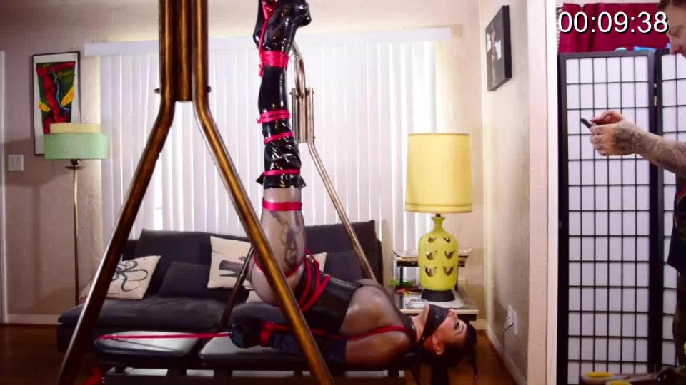 Nyxon.. The Inverted Swingin' Butt Tie https://www.clips4sale.com/studio/109572/18649143/Nyxon.. The Inverted Swingin' Butt Tie (mp4) 540p<br><br>Nyxon dresses up in one of my favorite outfits.. Winter Fetish mesh catsuit, vinyl high heeled boots, corset, and silky opera gloves. I had just bought a new frame for indoor tying and we decided to play around and break it in. I rig up an intricate crotch rope complete with butt lift, and band her legs up tight. I tie her ankles and hoist them up to the bar of the frame, locking them in place with the bar tucked inside the space of the boot heels. I tie her hands behind her and attach them to the bench supporting her upper torso. I place the ball of my nice Aussie Bondage panel gag into her mouth and pull it tight. Its video time. She shakes her suspended ass and moans playfully. We had a lot of fun with this.