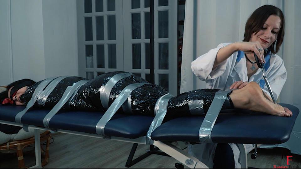 Anush's curative recipe - Long tickling in black tape by Doc Alina (FULL HD LOW BITRATE MP4) Anush's curative recipe - Long tickling in black tape by Doc Alina (FULL HD LOW BITRATE MP4)<br><br>From: Tickling in Russia<br><br>Anush needs some treatment procedures and Dr. Alina orders her an important therapy with tickling.<br>Anush is wrapped in black plastic and lies on the massage table. She’s in socks. The doctor blindfolds her and puts a ball gag in her mouth to isolate her feelings from everything around and make her silent.<br>Doctor Alina starts to tickle Anush’s feet through the socks. Anush is ticklish and she laughs and tries to wiggle. In addition, crazy Doctor teases her patient with the words like "Do you want more?", "What did you say?", "Okay, now it’s going to be more intense!"<br><br>https://www.clips4sale.com/studio/28730/18918789/Anush's curative recipe - Long tickling in black tape by Doc Alina (FULL HD LOW BITRATE MP4)