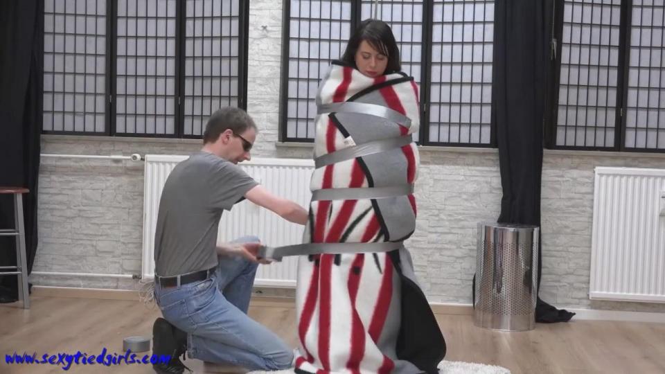 Irina mummified with really much tape Custom video - Irina first topless, then she will be tied up with 2 thick blankets tight around her body and secured with 2 rolls of strong tape and a thick tape gag.<br><br><span style='color:#b0b0b0;'>[隐藏文字，购买后可见]</span>