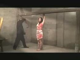 Chinese spy caught and tortured featuring: white dress, hanged,toroured
