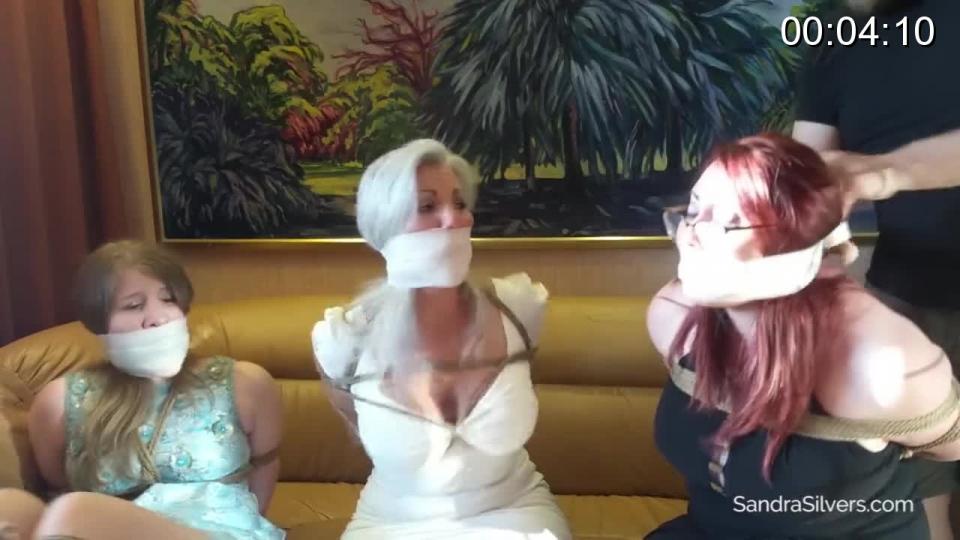 Three Curvy Captives Caught on a Cruise, Gagged in Gowns On-Screen! Escape Attempt! #1737 STARRING: Sandra Silvers, Ruth Cassidy & Salena Kent<br>The trio of traveling tarts were decked out in their formal frocks ready for a evening full of fine dining and frolicking. But the neighbor in the next stateroom had a different idea. He's going to immobilize and rob the rich bitches. All three ladies are tightly trussed and cleave-gagged. as they struggle, their words may be obscured, but their volume is not! He enters with a supply of elastic bandages (vetwrap) to securely seal the cloths into their mouths ensuring their silence while he makes his getaway. Together, the trussed triad tries to free themselves from their fetters to hopefully alert security before he makes his way off the ship!<br><br><span style='color:#b0b0b0;'>[隐藏文字，购买后可见]</span>