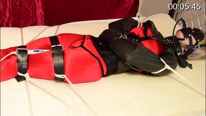 Trip Six.. Strapped Down to Cum.. First and Last Orgasm Trip Six agrees to be immobilized on the bed and to have multiple orgasms taken from her over the course of the night. First I slip her into a shiny red spandex catsuit with the crotch cut out. I add a tight satin corset and tall leather gogo boots. I place a thick leather blindfold over her eyes and cinch it tight. A harness style pump gag is strapped on over the top of the blindfold and inflated 3 full pumps to completely fill her small mouth. I slip her arms into the leather bolero straightjacket, strap it up tight, and padlock her arms to the back. I tell her to spread her legs. I attach a dildo head attachment onto my Hitachi wand vibrator, lube it up, and she lets out a yelp as I insert it into her pussy and rest the stimulator node up against her clit. I take a small piece of 550 cord and tie a crotch rope harness to hold it in place. She sits on the bed and I add thick leather belts around her legs and ankles. She is now helpless to do anything but squirm, but don't worry, were going to take that away from her too.. I pull her and stretch her out the length of the bed. I tie the top "D" ring of her harness gag to the bed rail. I move to her feet. I pull her down as tight as I can and tie her ankles to the bottom bed rail. I do the same with her leg straps, securing each to the side rails of the bed, and finally I wrap ropes around her arms and anchor them down to the sides as well. She is now unable to move anything at all. The Hitachi is firmly planted between her bound legs, and penetrating her. I plug it into a switch, which is controlled by a wireless remote with a radius of 100 feet. I tell her that I am leaving the room, but that Ill be controlling the vibrator and her orgasms for the night. With a click of the remote, she knows I wasn't kidding. The Hitachi shakes violently and she wasn't prepared, nor can she escape it. I take many orgasms from her over the course of the night.. This clip, is her last orgasm of the night.. It was almost morning. After a full night me turning the vibrator on and off, she was ultra sensitive and hadn't been able to XXXX.. Every time she would cum and start to dose off, I'd start it up again. Turning the vibrator on was becoming more cruelly painful than pleasurable for her at this point. The over stimulation was driving her insane. This video is intense! <br>超强度棒棒刺激束缚。<br>购买地址：<span style='color:#b0b0b0;'>[隐藏文字，购买后可见]</span>