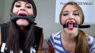 Gags &amp; Gag Talk - Raquel &amp; Terra Raquel and Terra want to play with their gags; compare the looks and styles of each gag while talking with them on. They use cheek retractors and show off their teeth while laughing at how silly they look. Next Raquel has a bone gag and Terra uses her "O" ring gag. While they're talking through their gags, Raquel produces a heavy amount of spit that drools out of her mouth. They put those gags away and pull out the dental gags. They slowly crank on their gags to expand their mouths wider. Again, Raquel can't hold her spit so she drools everywhere. Lastly, The two pull out the old fashioned ball gags. While gag-talking, Raquel drools, and so does Terra! This video is great for the gag fans, and for a good laugh! <br><br>https://www.clips4sale.com/studio/102601/16312554/Gags & Gag Talk - Raquel & Terra - WMV 720 HD
