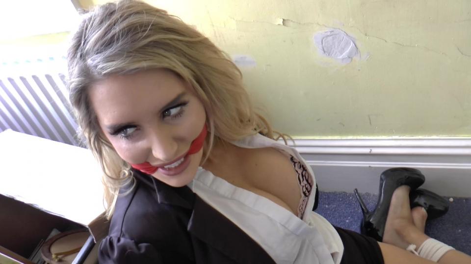 A Complicated Robbery  <span style='color:#b0b0b0;'>[隐藏文字，购买后可见]</span><br><br><br>Striking, sexy security lady Eliza is perplexed by the rambling old manse she has been stationed at by her employer, protection outfit Donut & MarshGas Est. Curious about what she is under assignment to guard, the uninformed beauty crossed her awesome thighs and settles in for the night.... Apparently, a rare item known as the Adelphi Stone is secreted somewhere within these walls. It is due to be moved to a local museum later in the month, now that the owner of Juggins Hall, a Mr Wilfred Goulash, has shuffled off the ol’ coil. The place is giving the busty lady here some measure of the creeps, and she finds solace in chatting with a member of her team over the radio. Just then, she hears something other than the voice on the other end of that thing. Definitely a stealthy bang. As if somebody tried to close a window gently and failed. She is up and looking around, terminating her call-in…<br><br>Behind her, in the great hallway. A beautiful blonde in tight black cocktail dress and heels waylays her and marches the  guard off upstairs. After binding an gagging her (awesomely she has her strip to her underwear while she watches, first) the duplicitous robber actually dresses up as Eliza, while the half-naked guard writhes at her feet, tied and with several strips of silver tape smeared over her trap. She can’t utter a word, which this brazen robber, Brook, is rather happy about. That’s why she gagged her ass, after all!<br><br>Having disguised herself as Eliza, should anybody enter the house while she is in the process of systematically turning it over in search of that stone, this little uniform she has on will at least buy her some time while she escapes! It’s a fiendish concept, and the tied and tape gagged woman stashed in that walk-in closet would attest to this! But, after some hot struggling, the stripped babe manages to work her wrists free! She is soon removing all of her ropes and that secure, sticky tape gag. Now she plans to get some payback. See how this busty bitch who did this to her likes being on the other end of the ropes.<br><br>Brook is searching the West Wing of the Hall, when she is suddenly coshed from behind. Moments later, she is securely trussed up in a store room with a tight red leather gag in her mouth. Unable to utter a word, she stares daggers at Eliza, who just as smugly as Brook had with her when she was on the giving end, bids her adieu. She intends to get changed into another uniform, and then call the police. But she doesn’t get that far… First of all, a masked robber (an effective one, this time) is baffled to find the guard already bound and gagged. But wait, this chick is a blonde, and the one he’s been scoping out had darker hair! This has to be somebody else! He doesn’t wait around to find out and instead, grabbing Brook by the lapels, hauls her off!<br><br>Eliza, having just changed again, is duly grabbed again! This time a tight hand is over her mouth as she is attacked by the second robber of her night! With both women tied up on the floor, he quickly gets a gag on Eliza and leaves them writhing helplessly as he searches the Wing himself. Something tells us, he’ll be a lot better at it than the presently tied up and cleave gagged Brook! The ladies, by the way, are mad. Neither can comprehend this is happening to them as they squirm passionately, chewing at their tight leather cleave gags.<br><br>After some sexy struggling, it’s Brook’s garbled gagged up idea to shuffle in behind the guard and work with her at getting loose their wrist restraints. But it’s no good. They are lashed up too securely. The girls mutter their outrage and continue struggling…. Right up until a familiar shadow fills the doorway again. One carrying tape and more rope! Soon enough, the ladies are bound and now taped up on wooden chairs, still insanely tightly cleave gagged, bouncing around angrily. How long must they both be restrained and gagged like this. While they think about that, the robber returns with some filthy socks from the washbin.<br><br>One by one, the resisting (as much as they are able to, anyway) hostages have their mouths stuffed with them and then multiple strips of that same screeching black tape are slapped and smeared over their kissers. Sufficiently muffled and super tied on those seats, the robber is ready to move on to the East Wing and onto do Sultan’s Lodge, nearby, on its way out. These two can hit no panic button, trip no alarm, and make no outbound calls. They are trussed and gagged very, very thoroughly and they know it.<br><br>Bouncing around in their seats, the humiliated babes are not taking this well. If they didn’t have their faces sock-stuffed and sealed like a dam with a lot of tape, we wonder how long this guy would last. They are irate! But we’ll take that any day of the week. Because the fun in this amazing vid is not over yet. We have a lot more gag talk and chairbound theatrics to wade through before this Goodnight is said, and with two exceptionally accomplished damsels tied down and in motion, we couldn’t think of anywhere better to be right now than watching them go at it from the shadows. We kind of hope that guy finds what he came here for now. He’s earned that Adelphi Stone getting the ladies all tied up and powerlessly furious for us like this, has he not? What a caper!