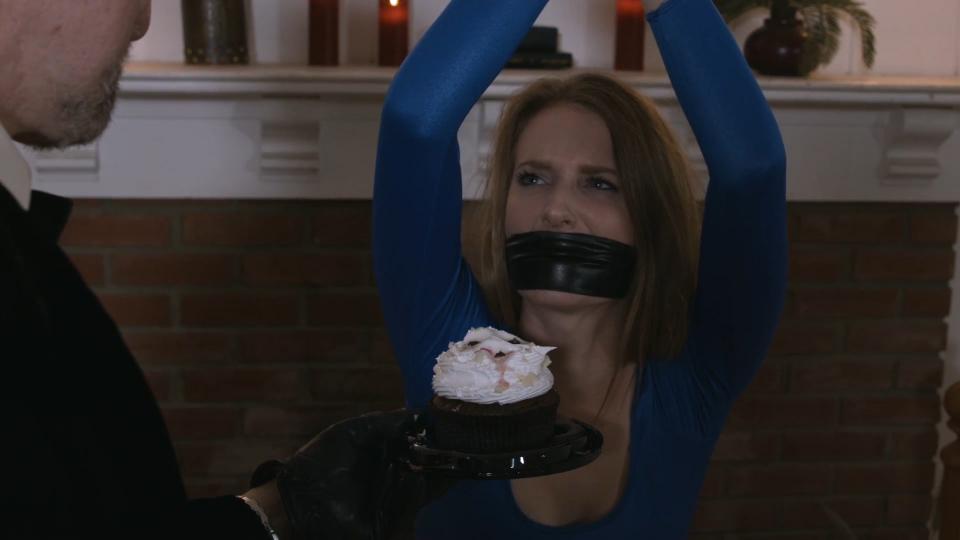 I Now Pronounce You Villain and Wife MP4 I Now Pronounce You Villain and Wife MP4<br><br>From: Bondage Babes in Peril<br><br>Starring Ashley Lane<br>Ashley is joined by legendary bondage producer Jon Woods for this fun, campy scene. Superheroine Neon Girl (Ashley) goes looking for some missing superheroines. She looks around the headquarters of evil Dr. Miracolo. Suddenly, the doctor sneaks and handgags her. Neon Girl struggles hard and tries to curse at her captor but his hand makes her unintelligable. When we next see her, she is tightly bound. Miracolo gags her with tape and quickly begins fondling her. He tells her that he captured all the superheroines for his collection but that she will be his most prized possession. In fact, he plans to make her his wife! The poor heroine endures more humiliating groping and taunts before Miracolo leaves to plan the wedding. She struggles some more but it is useless. Later, Ashley is in a wedding dress (!) and tightly bound and gagged. Miracolo torments her with more groping and cruel taunts about how she will be his forever. The minister arrives and performs the wedding. Neon Girl is defiant, screaming her objections through her ballgag. When it’s time for Neon Girl to say her vows, the villain removes her gag and handgags her. She still won’t give in but the minister declares them villain and wife anyway. Miracolo picks his new wife up over his shoulder and spanks her ass. Flash forward to three years later... A cupcake with 3 candles sits to the side while Neon Girl is bound and gagged on the bed. Miracolo enters and gropes his unhappy spouse. He taunts her cruelly, telling her how he discovered her true identity years ago and that he faked her demise to explain her disappearance. He tells her how, on their last anniversary, he sneaked her, bound and gagged, into her parents' house and groped her in their attic. He tells her that her ex-fiance is now engaged to her rival. Neon Girl struggles and whimpers endlessly. But she resigns herself to the fact that she will forever be Miracolo’s wife and sex slave. Scene #SHBD0013<br><br><span style='color:#b0b0b0;'>[隐藏文字，购买后可见]</span>