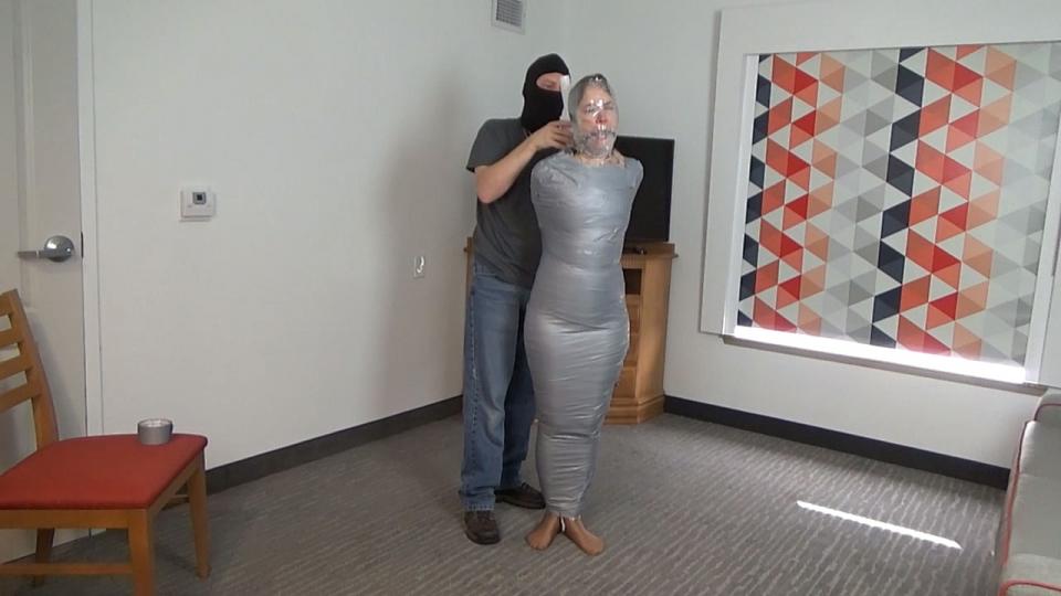 Rachel Adams-- Ultra Girl and The Mole Full Length MP4 Ultra Girl has been captured by The Mole, an evil double agent wanted for selling secrets to an enemy state. The sexy superheroine awakens to find herself tied up in a hotel room belonging to The Mole. She instinctively looks for her power belt, but it is no use as it has already been removed and disposed of by her captor. She struggles in the ropes and bondage as The Mole taunts and gropes her. <br><br>Ultra Girl's boots are removed, exposiing her nhylon clad feet. Her ankles are retied and she is informed that it is time to prepare her to be transported to The Mole's hideout. A gag is placed in hermouth to quiet her protest and she is stood and placed in the middle of the room as she continues to struggle to escape. <br><br>Soon the sexy superheroine finds herself being wrapped up tight with shrink wrap. The double agent slowly and maticulously moves from Ultra Girl's ankles to her shoulders, wrapping her nice and tight. With the shrink wrap layer in place, The Mole begins the process of turning Ultra Girl into a mummy. With tape in hand, the double agent again starts at her feet, slowly working his way to her shoulder, mummifiying the sexy superheroine in a tight cocoon of duct tape. <br><br>To finish off the process, Ultra Girl's head and face are then wrapped in a tight layer of shrink wrap followed by a tight layer of duct tape. Mummified, silenced and sightless, the helpless superheroine is laid down in the floor. She is taunted a bit and left to struggle in the floor as The Mole makes the final preperations for her transport to his hideout to be interrogated. <br><br><span style='color:#b0b0b0;'>[隐藏文字，购买后可见]</span>