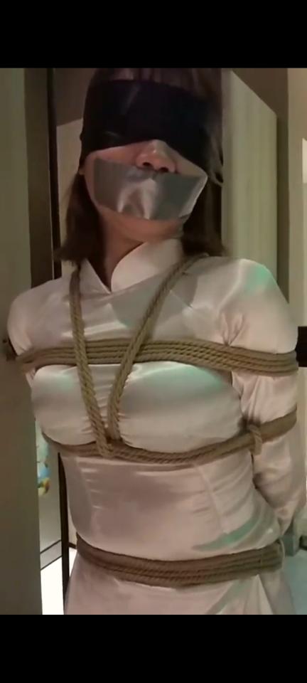 Viet Nam Bondage Girl with áo dài costumer. Bound and gagged