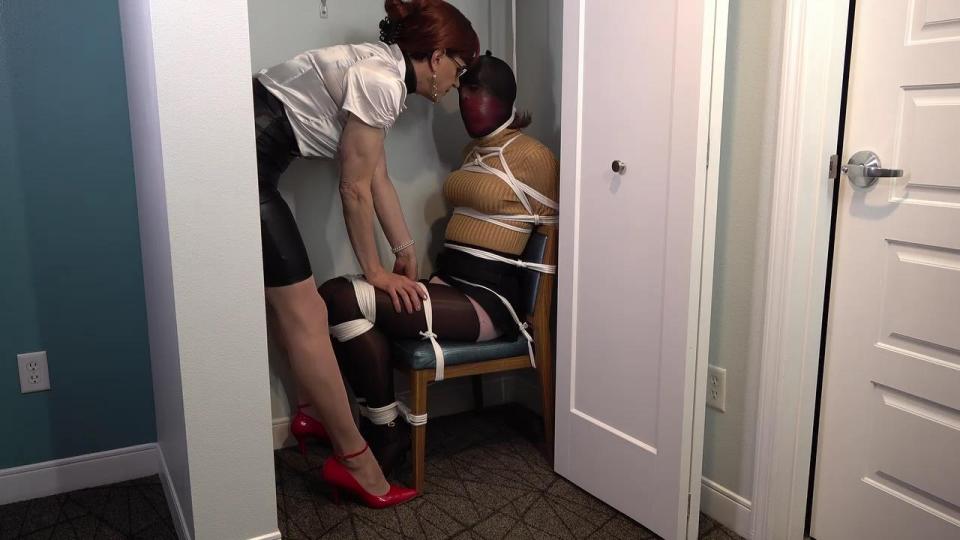 Mature Milf Jeanne and Sandra Discuss Their Sleeping Arrangements <span style='color:#b0b0b0;'>[隐藏文字，购买后可见]</span><br>Mature Milf Jeanne and Sandra check into a nice resort hotel room for the weekend but Sandra realizes that there's only one bed.  She tosses and turns and finds it impossible to sleep with another person nearby so she coyly asks her friend Jeanne if she'd like to get tied up before they decide what to do for the evening.<br><br>Jeanne's a big bondage slut so of course she agrees, expecting a casual little play scene.  Instead she has her mouth stuffed with a huge pair of panties, then vetwrap tightly wrapped over that, and then tied up on the bed to struggle.  After a while Sandra decides that Jeanne should be chairtied too, so she tightly lashes off her friend and adds a tight pantyhose hood over her head to keep her all tight and sealed up.<br><br>Finally Sandra slowly works the chair into the closet and tells her friend that she better stay quiet while Sandra lies down for a little while, letting her know that she'll deal with her later. Jeanne is so strictly bound, gagged and stuck that there's nothing she can do as her friend finishes up her bondage and prepares to leave her in the closet for a long long night...