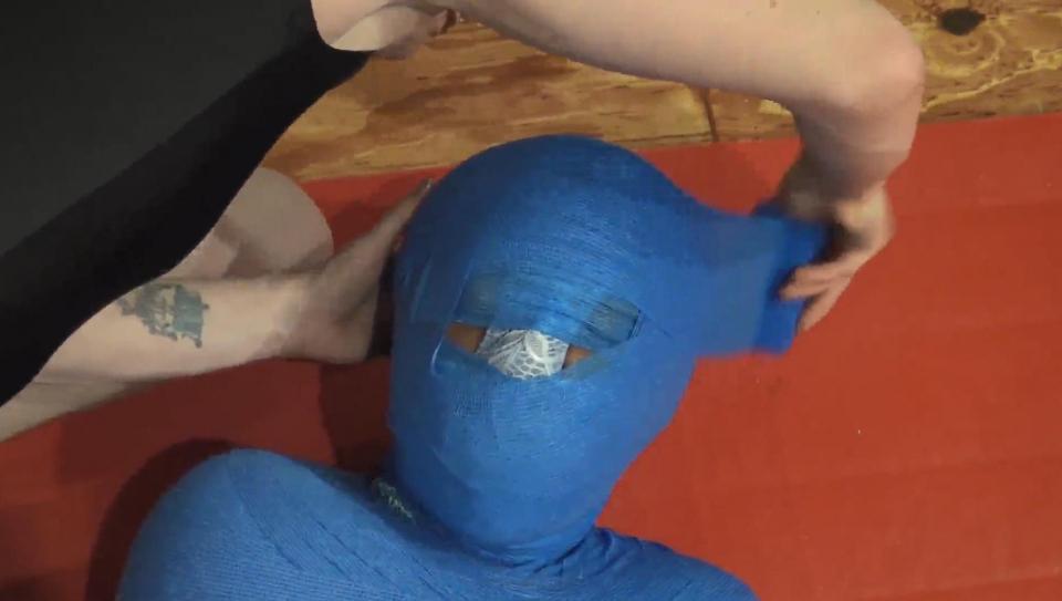 Lana's Full Mummification Bondage Challenge! (1280x720) Lana Luxor is a brave soul when it comes to bondage challenges.  Here, by special request, she takes on her most nerve-wracking challenge yet: total body and head mummification, complete with reinforced gags!  Follow us through this adventurous first-time experience... this is all filmed continuously with no cuts during the entire challenge.<br><br>Lana starts out in a shiny blue nightgown and sits casually as VeVe first binds Lana's ankles, knees, and wrists (in front) with blue fabric sashes.  Lana is smiling and up-beat; this doesn't seem too hard...  VeVe then starts wrapping Lana up with blue vet wrap, and she's got a LOT of the stuff.  VeVe wraps up Lana's entire body in the vet wrap, pausing briefly to gag Lana by stuffing 2 pairs of panties in her mouth, adding a tape gag on top, and then covering Lana's face with another pair of panties.<br><br>VeVe gives Lana a trial to see if she can escape at this point.  And when Lana breaks her hands free of the mummification, VeVe doubles down by vet wrapping Lana's hands together and then re-wrapping the whole thing back into the mummy.  Once that's set, VeVe moves in for the final piece.  She then encases Lana's entire head and neck with the vet wrap (except for a small opening for the panty-covered nose).  Serious business!  Putting Lana's fortitude to the test!  VeVe then leaves Lana to attempt an escape.  Lana hangs in as long as she can, struggling to escape and gag-murmuring in despair.  It's a truly harrowing moment!  Escape is absolutely impossible and after several long minutes, she must give up.<br><span style='color:#b0b0b0;'>[隐藏文字，购买后可见]</span>