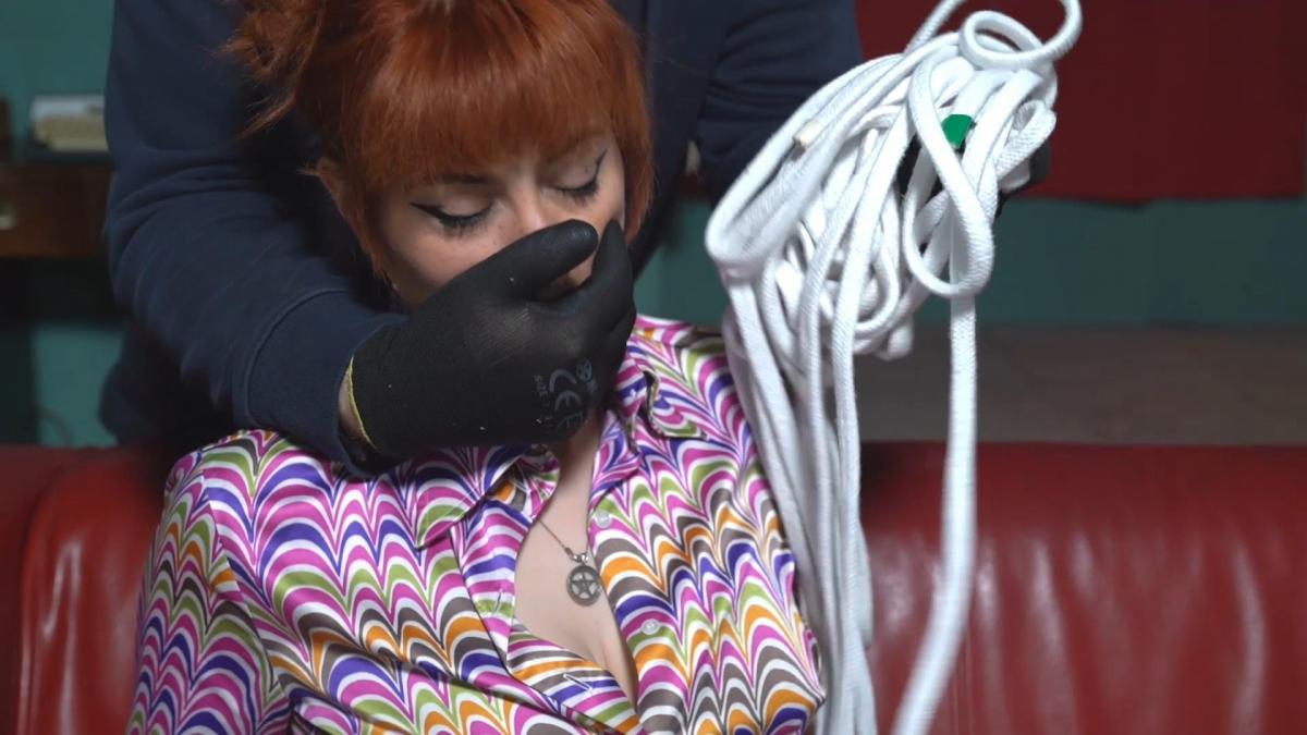 2145 Amber in Office Bondage Dream What a day! it all starts with Amber having to tell one of her staff off.....er, herself! Well this is AGB world right. So Amber, who is already tied to a chair gets gagged on screen with some wrapping by JW. wearing a blouse and short skirt with stockings and heels she wriggles in that office chair. <br><br>Amber soon gets home somehow and is relaxing at home reading her favourite magazine, Miserabilistic Misanthrope. Its full of bondage ideas, oh and a wordsearch, which she loves. This gives her ideas and she gets the rope out of her secret drawer and thinks about what could be done with it. Well don't worry, the mysterious JW is right there to use it on her, putting her into a tight hogtie and cleave gagging her with a strip of cloth.<br><br>Shortly after, JW comes back and releases the hogtie and then moves her up to the attic....<br><br>In the attic, still in her blouse skirt and heels and strip gag, Amber is tied Strappado to the rafters. There's not a lot she can do about all this.<br><br>Again, somehow she gets home and goes straight to bed, maybe it was all an elaborate daydream. She kicks off her heels and clothes revealing her vintage underwear. But whats this round her neck? the strip gag!? so it wasn't a dream? Amber really enjoyed the excitement of the bondage and puts the gag in as she settles down, but then JW is suddenly there again putting her into yet another rope hogtie but this time just in her lingerie. The best of times and the best of Amber.