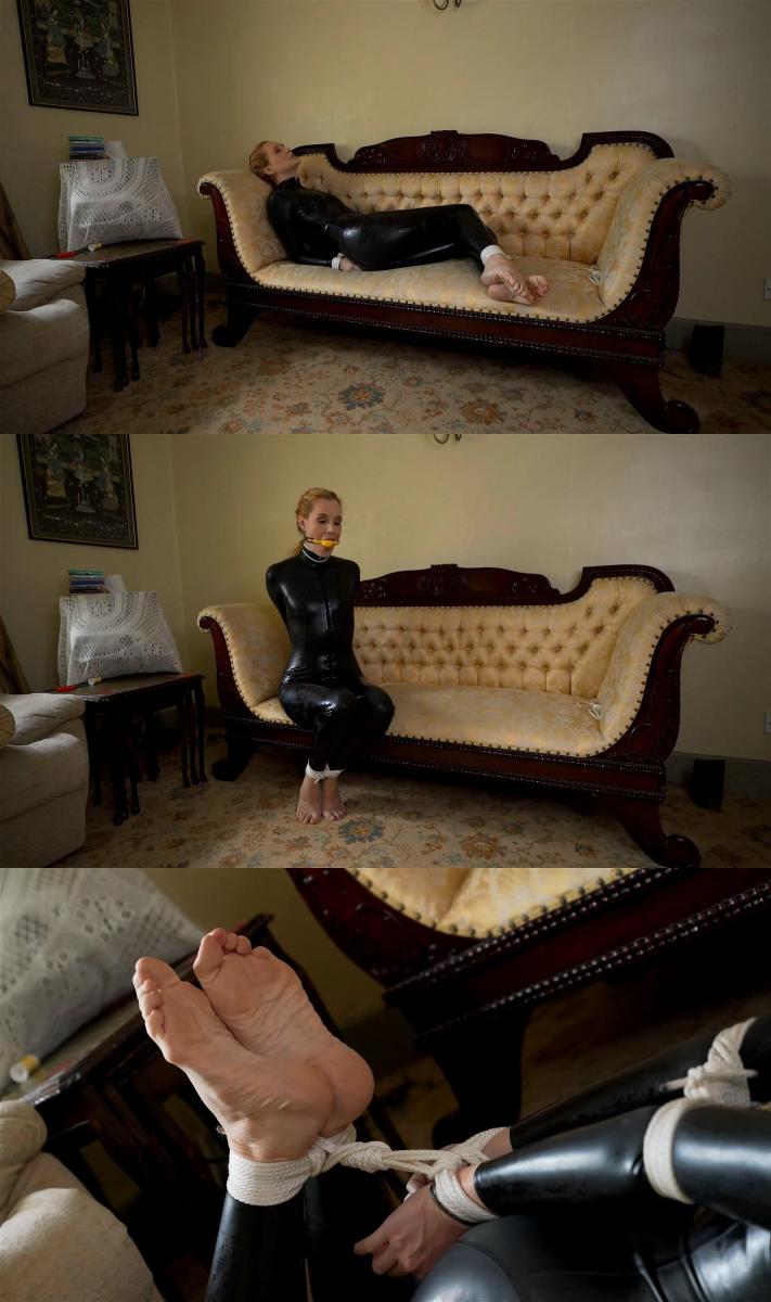 Hogtied Barefoot In My Catsuit Ariel Anderssen - <br>My master calls me in, and I'm already dressed exactly as he likes, in my black latex catsuit and bare feet. He tells me to put my feet in his lap, and when I do so he immediately starts tying my ankles together. I suspect this is all a precursor to his punishing me for being so naughty this morning, and I feel my suspicions are about to be confirmed when he ties my hands behind my back too. Hmm, but then he leaves me to struggle gently on the sofa. This doesn't feel like a punishment yet! Perhaps it's a test - does he want me to admit that I *need* to be punished?  That seems scary, but also exciting. I suggest that perhaps I need to be collared and ballgagged with our biggest gag, since I was so badly behaved?  He orders me to lie on the floor, and then, collared and gagged, he turns the tie into a tight, punishing hogtie.  I can barely move; only my hands and bare feet can really do much wriggling as I lie there in my catsuit, feeling very naughty indeed!<br><br>我的主人叫我进来，我已经穿着他喜欢的衣服，穿着黑色乳胶紧身连衣裤和赤脚。 他告诉我把我的脚放在他的腿上，当我这样做时，他立即开始把我的脚踝绑在一起。 我怀疑这是他今天早上惩罚我这么顽皮的前兆，我觉得当他把我的手绑在我背后时，我的怀疑也即将得到证实。 嗯，但后来他让我在沙发上轻轻地挣扎。 这还不像是惩罚！ 也许这是一个测试-他是否希望我承认我*需要*受到惩罚？  这似乎很可怕，但也令人兴奋。 我建议，也许我需要领和球堵住我们最大的演出，因为我是如此糟糕的表现？  他命令我躺在地板上，然后，衣领和堵嘴，他把领带变成一个紧，惩罚hogtie。  我几乎动不了，只有我的手和赤脚才能真正做很多扭动，因为我躺在我的紧身连衣裤里，感觉非常顽皮！<br><br>Саtеgоriеs: FOOT, FEET FETISH, JOI, FOOT WORSHIP, FOOT TEASE, DANGLING, PANTYHOSE, SOLES, femdom, girl domination, humiliation, bondage, shibari, rope bondage, shibaru, suspension, belts, bedtie, hogtied, tight bondage, strict bondage, bound elbows, struggling, ballgagged, helpless<br>分类：脚，脚恋物癖，JOI，脚崇拜，脚挑逗，晃来晃去，连裤袜，鞋底，女性主导，女孩统治，羞辱，束缚，shibari，绳索束缚，shibaru，悬挂，腰带，bedtie，hogtied，紧束缚，严格束缚，束缚肘部，挣扎，ballgagged，无助<br>