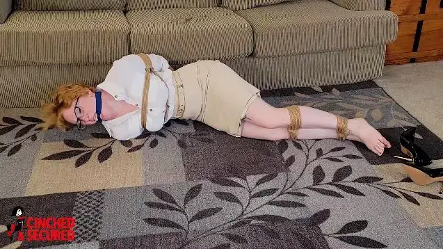 1238 - Izzebella - Tutor Tied and Topless Izzebella had been hired as a tutor by a wealthy family, but it seems the little "students" have no interest in [paying attention to her.  What they are interested in is tying the luscious redhead up nice and tightly. Izzebella at first struggles, demanding to be set free, but her would-be pupils tire of her noise and cleave gag her, her mouth stuffed with rags! Furious, she struggles and gag talks up a storm, but the one thing these students did not have to be taught was how to bind a woman! In a rage<br><br>