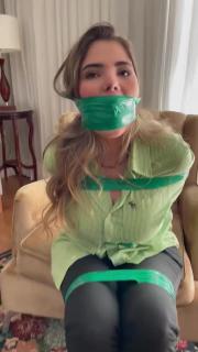 Brazillian girl tape gagged Brazillian girl tied up with green tape and wrap gagged