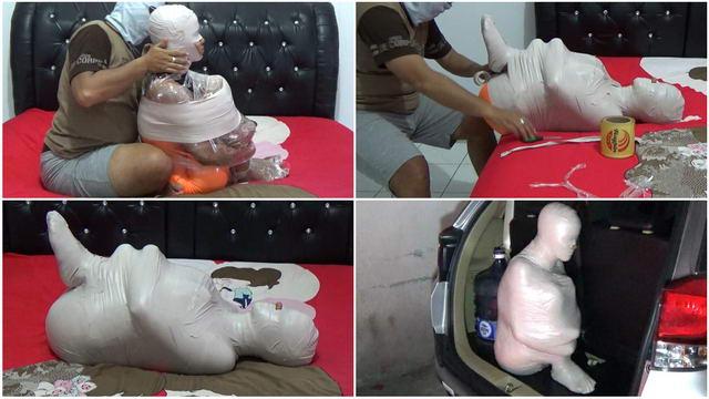 This girl was helpless when put in the car because her body was wrapped tightly. Randy Mummification A beautiful girl wearing an orange swimsuit and tightly wrapped in white duct tape.<br>This girl is wrapped in a sitting position so that her body is totally motionless when her head is wrapped in plastic.<br>The girl’s body is then lifted and put in the car and ready to be shipped to the buyer.<br><span style='color:#b0b0b0;'>[隐藏文字，购买后可见]</span>