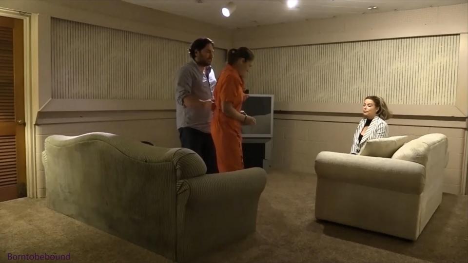 Prison escapee finds herself in an even worse situation A woman thinks she sees someone out in her yard. She asks her man to go and check it out. He comes in with a woman in prison jumpsuit on and she is still cuffed with a waist chain, lockbox and leg irons. She claims to have escaped abuse and begged them to help her. The woman goes to get her some clothes and the man happens to have a handcuff key on him having been an employee at the prison. Instead of giving her comfortable clothes she is given lingerie,  a girdle, bra and fully fashioned stockings. She begs for a sweatshirt but she doesn’t get one. She reluctantly gets dressed in the lingerie. The woman grabs her prison panties and says that she is going to soak them in the sink. The escapee pleads for her not to. The panties were soaked, but not in the sink….Rachel soon finds herself tied to a bed with an enormous ballgag between her lips.  Her legs are pulled over her head putting her in a terribly uncomfortable situation with her elbows bound and wrists pulled back to the headboard.<br><span style='color:#b0b0b0;'>[隐藏文字，购买后可见]</span>