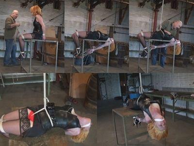 Bend over a table in a cruel crotchroped hogtied Pretty red head Destine sits on an old steel work table in the lair watching helpless as the Hunter sorts through some rope. Her wrists are tightly bound behind her back and her ankles and knees are tightly bound together. Her mouth is packed and a tight cleave gag is tied over the packing stifling her begging and pleading. He grabs some ropes and come back to her and ties a very tight crotch rope between her legs. Destine grunts in pain as he pulls her elbows together so that they kiss behind her back and ties them tightly together. He pushes her back so that her arms are under the table and attaches a rope from her bound ankles to her wrists hogtying her on her back. He then pulls the end of the crotch rope up to an overhead pulley and pulls it tight. Destine is to arch her back as the crotch rope digs deep into her pussy and ass. He secures the ropes and leaves her in her tight immobilizing bondage. Destine cries and begs into her gag, she doesn't know how long she will have to endure the brutally tight ropes.<br><br><span style='color:#b0b0b0;'>[隐藏文字，购买后可见]</span>