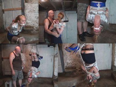 Inverted prey on display The Hunter's pretty redheaded neighbor, Gwendolyn, finds herself in trouble once again in his basement. Left sitting on a block with her arms tightly bound and twisted up behind her back in a strict reverse prayer. Her slender legs are tightly bound at her ankles and knees and a rag has been stuffed into her mouth and cleave gagged. She is screaming into her gag in frustration and then struggles to her feet and tries to hop away. But the Hunter catches her febble escape attempt and scoops her up into his arms. He carries her over to his trapeze bar and drapes her legs over the bar. Gwen screams into her gag in fear as he lowers her head until it is only a few inches off the concrete floor. He then ties a rope from her ankles and around her thigh pulling her feet down so she can't slip off the bar. She continues screaming and crying so he wraps black electrical tape over her gag to stifle her cries. Gwen struggles on the bar wriggling and squirming as the Hunter tauts her. He goes to get more rope and returns to attach a rope from her arms to her feet to pull her back into an arch and put a stop to most of her squirming. He leaves her hanging there alone and helpless swinging in the air.<br><br><span style='color:#b0b0b0;'>[隐藏文字，购买后可见]</span>