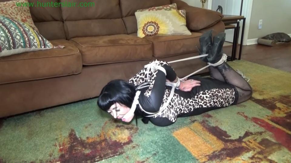 Busty MILF brutally bound in her first chicken wing hogtie  Busty raven-haired MILF Luna is pushed into the living room with her arms fused together behind her back in rope. Her poor elbows are jammed completely together and her forearms are fused into a single unit with her wrists tightly bound. Luna screams and protests into her gag as the Hunter sits on the sofa and pulls her into his lap and begins to paw and grope her helplessly bound body. Luna continues to kick, protest and struggle on his lap until he finally stops groping her in frustration. He tells her that if she isn't going to stop struggling and cooperate he is going to have to enforce compliance. Luna tries to kick him so he grabs her ankles and wraps more ropes around the tops of her leather ankle booties. LUna still has plenty of fight in her as the Hunter struggles to tie her ankles. She slips her knees to the floor as he finishes knotting off her ankles. He tells her to stay put while he goes to get more rope, but Luna has no intention of staying put as she rolls onto the floor and tries to crawl away. But she doesn't get very far as the Hunter returns with more rope. He sits her up between his legs and wraps more rope around her shoulders and then runs the rope down her spine to her bound wrists. The rope is slide between her wrists then her hands are jerked up high up her back forcing her crushed elbows to jut out from her back with her hands pulled to the top of her hips in a cruel chicken wing. Luna grunts and cries in pain as her arms are twisted up in the cruel chicken wing but she isn't ready to stop resisting. So the Hunter rolls her over onto her belly and cinches a rope between her bound wrists and spine then runs the rope down between her bound booted ankles. Luna groans and cries into her gag as her legs are bent up into a strict hogtie. The rope is then fed between her bound elbows and pulls bow string tight. The Hunter tells her that after an hour or two in her evil chicken wing hogtie she will be more compliant. Luna sobs and cries into her gag as her tries to struggle but the ropes are too tight, she can barely move. She begs and cries into her gag not knowing if she can endure a few hours of such brutal bondage.<br><span style='color:#b0b0b0;'>[隐藏文字，购买后可见]</span>