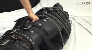 bound_with_20_belts Woman bound with 20 belts and in a straitjacked is made to cum.