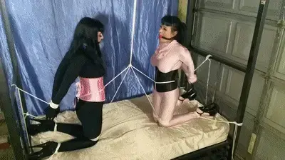 Nyxon and Luna Dawn.. Crotchrope Tug O War Nyxon and Luna Dawn are dressed in opposite colored spandex catsuits, ballgagged tightly, and tied up opposite each other on the rack with legs apart. A single rope is attached to both of their waists and drawn up through their crotches to a pulley on the ceiling. When one pulls, the other one suffers and vice versa.. This should make for quite an interesting struggle!<span style='color:#b0b0b0;'>[隐藏文字，购买后可见]</span>