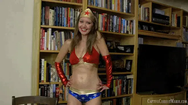  0634 Win A Date With Wonder Chrissy! Wonder Chrissy enters the home of a lucky fan who has won the "Win a Date With Wonder Chrissy Contest” and congratulates him on winning the contest. She sits down across from him and talks about how it is nice that she can take a day off from patrolling the streets and fighting crime. She mentions that it’s always fun to be able to hang out with her fans and this contest was a good opportunity to do so. However, she flirtatiously admits that one thing she will miss out on is getting captured by a villain and being taken advantage of. "Can you keep a secret? I actually love getting captured by villains. Sometimes, I'll purposely walk right into their traps just so they will tie me up and torture me!” Wonder Chrissy is feeling especially frisky today as she continues to flirt " So, I have an idea of how we can spend our time together. How about you be the evil villain that has captured poor little me? I think that would be a lot of fun." Chrissy then gets up, raises her hands in the air and begins playing the role of a superheroine that’s just been caught by a villain. “Hmph! Looks like I fell into your trap, you evil villain...now what are you going to do to me…”<br><br><span style='color:#b0b0b0;'>[隐藏文字，购买后可见]</span>
