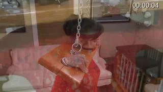 BondageJunkies555 女人被戴上扣球和枷锁吊缚在房子里，无助的她此时还穿着芭蕾高跟靴
