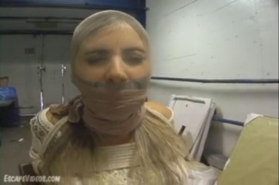 Jenny Gagged in a Pantyhose Hood Jenny Gagged in a Pantyhose Hood. Our gorgeous blonde model Jenny gets her head covered in tight pantyhose in her latest action-packed bondage clip! She's looking good today, as usual, dressed in a pair of open toe high heels, a short skirt and a long-sleeve top. We always tie this girl up nice and tight because she is so flexible! We secured her in a chest harness, with extra rope connected to her wrists that are bound behind her back. We also pinned her legs together in three places and gagged her with duct tape. <span style='color:#b0b0b0;'>[隐藏文字，购买后可见]</span>