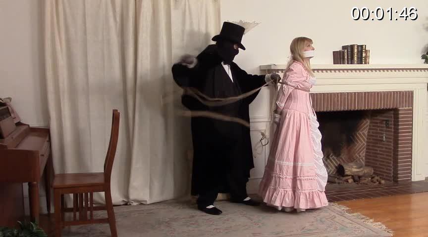 Damsel in the Fireplace - Lorelei in Pink Gown - MP4 罗蕾莱小姐的危险第 1 集。这所房子可能是一个通风良好的老地方，但它是罗蕾莱小姐温馨的家，所以她拒绝将契约交给 Blackstone Emerson Claw III 教授。 黑披风恶棍将罗蕾莱小姐（粉红色长袍、衬裙等等）彻底绑起来，把她塞进壁炉。 他离开去寻找他的火柴盒，而罗蕾莱小姐与她的束缚作斗争，哼唱着她的两层堵嘴（劈开堵嘴加上嘴上堵嘴）。 她能逃脱这迫在眉睫的危险吗？<br>The Perils of Miss Lorelei Episode 1. This house may be a drafty old place, but it's home sweet home to Miss Lorelei, so she refuses to sign the deed over to Professor Blackstone Emerson Claw III. The black-caped villain ropes up Miss Lorelei thoroughly (pink gown, petticoats and all) and tucks her into the fireplace. He leaves to find his matchbox, and Miss Lorelei struggles against her bonds, mmphing through her two-layer gag (cleave gag plus overmouth gag). Will she escape this impending peril?<br><span style='color:#b0b0b0;'>[隐藏文字，购买后可见]</span>