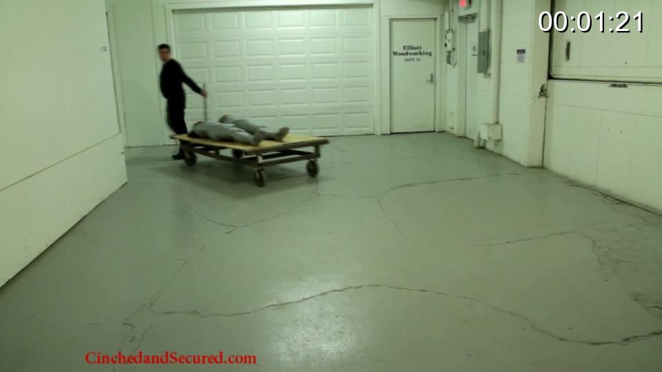 054 - Dakkota and Joanna - Warehouse Bound! (part 3) The girls have finally reached the end of the line.  After having been kept bound and gagged, a buyer has finally been found....for one of them!  The other is to be disposed of once and for all.  As the mummified girls struggle, they wonder who will be sold and who will meet their demise.  They know escape from their cocoons is impossible, and so they whimper helplessly as they are wheeled through the deserted warehouse on the way to their successive fates.  Poor Joanna is on her way overseas to become a sex slave, while Dakkota is taped to a pole, unable to move even a finger to help her partner.  She watches helplessly as the poor young girl is wheeled away, sobbing into her gag.  Now Dakkota is left alone, waiting for the end.  The crazed has scheduled the building for demolition, and Dakkota can only wiggle and squirm helplessly as she counts down the seconds to the explosion that will mean her doom!The girls have finally reached the end of the line.  After having been kept bound and gagged, a buyer has finally been found....for one of them!  The other is to be disposed of once and for all.  As the mummified girls struggle, they wonder who will be sold and who will meet their demise.  They know escape from their cocoons is impossible, and so they whimper helplessly as they are wheeled through the deserted warehouse on the way to their successive fates.  Poor Joanna is on her way overseas to become a sex slave, while Dakkota is taped to a pole, unable to move even a finger to help her partner.  She watches helplessly as the poor young girl is wheeled away, sobbing into her gag.  Now Dakkota is left alone, waiting for the end.  The crazed has scheduled the building for demolition, and Dakkota can only wiggle and squirm helplessly as she counts down the seconds to the explosion that will mean her doom!<span style='color:#b0b0b0;'>[隐藏文字，购买后可见]</span>
