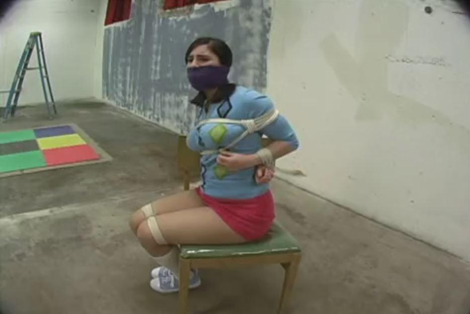 Charlotte Hopping, Fondled and Hooded Charlotte Hopping, Fondled and Hooded. Our busty doll Charlotte get her huge tits fondled, pinched and groped in her latest bondage video here at Escape Videos. We start the scene with Charlotte tied up in an argyle sweater, a miniskirt, knee socks and sneakers. Her captor comes in and wraps a purple ace bandage around her mouth sealing it shut. You can see the fear and frustration in her eyes. Hot! Next, her captor takes some pantyhose and slides it over Charlotte's head smushing her face and holding her gag in place. The ends of the pantyhose get wrapped around her head and get tied off. Now the fun part starts.<span style='color:#b0b0b0;'>[隐藏文字，购买后可见]</span>