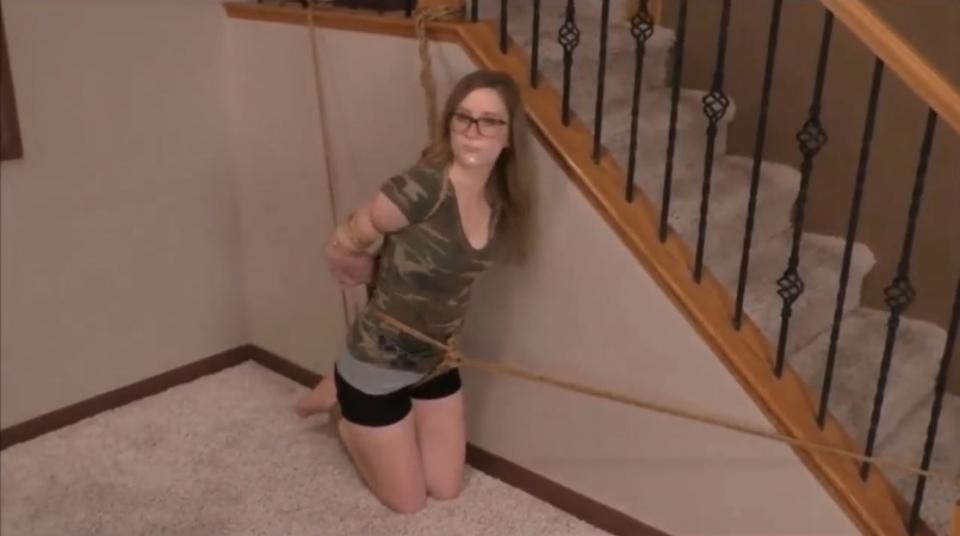 Madison Grove BTS (2) Madison Grove BTS (2) (HD). Madison is tied up on her knees and a crotch rope. She is also gagged with a clear tape gag showing red lipstick on lips. <span style='color:#b0b0b0;'>[隐藏文字，购买后可见]</span>