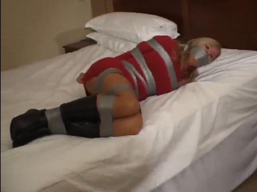 Could this gag be any tighter ? Could this gag be any tighter ?. Dakkota is taped up good and tight wearing a sweater dress and boots ! Her mouth is packed and tape wrapped very tight. She struggles and squirms on the bed and eventually hops over to the door and it is not easy with her ankles and legs bound tight ,but she makes it to the door and tries to kick the door handle open. <span style='color:#b0b0b0;'>[隐藏文字，购买后可见]</span>
