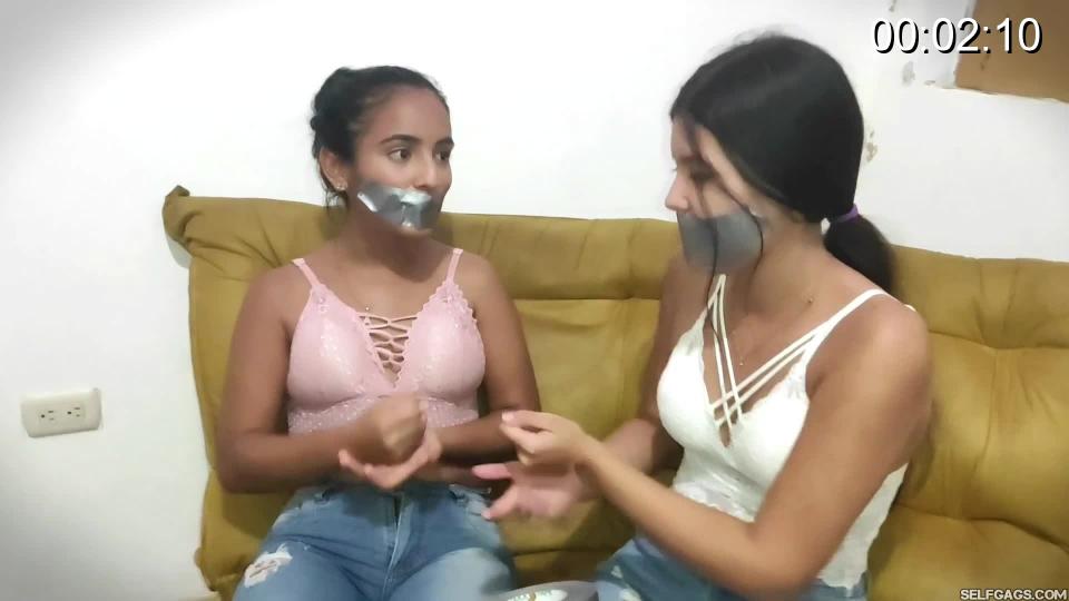 Mary &amp; Anli in- Rock, Paper, Scissors, GAG! Mary and Anli are bored. Mary wants to find something fun to do with her friend and comes up with an idea to play a game of rock, paper, scissors in which the loser of each round must have a piece of duct tape put on her mouth. The girl who first loses three rounds must also be tied up by the other girl!<br><br>As the game evolves, it becomes a close run between the two sweethearts who both win and lose and therefore get their mouths taped shut. But Anli is the one who loses three rounds and so she gets tape bound by Mary who also remains tape gagged!<br><br>Once Mary has tied up Anli, Mary takes off one of her own stinky socks, removes Anli's tape gag, and flaunts the sock at her. Anli demands to be let out of her bondage but Mary doesn't care about Anli's request and simply shoves her nasty worn sock in Anli's mouth while she still remains gagged herself!<br><br>Mary wraps duct tape around Anli's sock stuffed face, making her a nice and effective tape wrap gag. As soon as Mary has gagged Anli, Mary pulls her own classic tape gag off, drags one sock off of Anli's feet, and stuffs it inside her own mouth, right there in front of Anli!<br><br>Mary laughs as she gags on Anli's sweaty sock with Anli staring at her in confusion. Mary then goes on and gags herself by wrapping tape around her head similar to the way she has gagged Anli. Playful Mary hugs her bound and gagged friend, kisses her, and loudly gag talks at her.<br><br>Mary is having such a good time being gagged with bound and gagged Anli who doesn't seem to enjoy the game as much as Mary does. Anli is helped up on her feet and, with muffled instructions, told to jump out of the room. But Anli is hopeless and so Mary escorts the poor thing out of the room by making her hop along with her!<br><br><span style='color:#b0b0b0;'>[隐藏文字，购买后可见]</span>