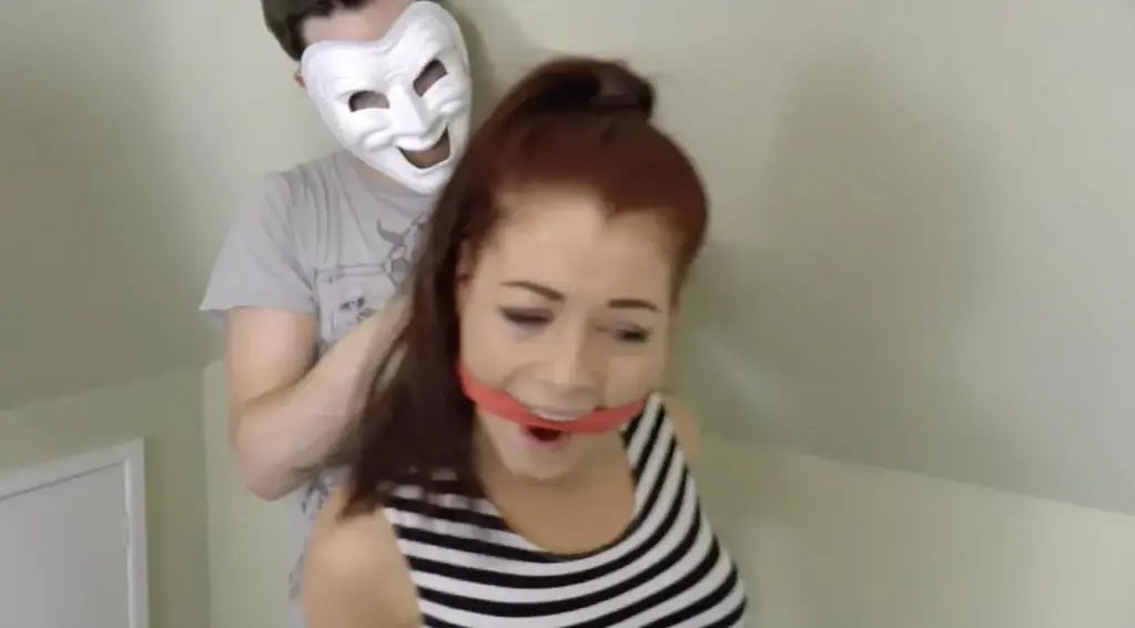 Georgie &amp; Amber in: Sneaker Girl Detective Meddlers &amp; the Spanish Gold Mystery! (Part 2) Gag (1280x720) (HD)<br><br>Time to gag up these two from fittingly attired, jeans clad meddlers with sweaty socks from Ambers sexy feet then. Ooosh!<br><br>Converse and canvas pumped beauties, Amber and Georgie, have been captured up at the Old Feathered Cape Place. While snooping no less! Who would have thunk it?? Gagged and bound for hours, held in a dingy back room, the spunky girl detectives are still more than a tad at the mercy of the deranged self appointed protector of the plundered Spanish Gold they seek.<br><br>Now, having been removed from stringent chair ties and getting feisty, the girls have their wrists taped hard together, crossed style. They are both savagely tightly gagged with thick red cloth and tied up on a bed and on the floor respectively and left once more to wriggle about and moan around their cleave gags. Gorgeous stuff and so sexy with all that Converse swinging, bound up action going on while both hot damsels try hard to talk through their cloth muzzles. This earns them a true punishment.<br><br>Ambers warm Converse are plucked from her sock clad feet, and then the socks pulled from her flexing, resistant bare feet. Said socks are jammed straight into the mouths of the plucky strainers, cutting them off in mid defiance. Resolutely clave wrapped again, this time with many turns of tape, the bound and helpless women are once more left to squirm, all barefoot and fighting hard against their uncompromising restraints. Their wrist bounds to their waists also, the restriction here is even more certain. All they can do is fall over sideways and writhe about on the floor in various stunning positions. Still, that's all we WANT them to do, right? Giving us all an incredible jolt of excitement that will last a good while watching this sexy pair struggling and straining.<br><br>The amazing facial gestures, stringent bondage and huge gags on the table are once more vital components in making this steamy conclusion well worth the extended wait. And, to make up for it, we leave these two entwined wrigglers all trussed up like this for even longer, while the crooks prepare their van for them. Oo. Er! Looks distinctly like our well packaged little jeans clad snoops, all bound up like prize sausages, are going for one heck of a ride later. A bit like the one you will soon no doubt be experiencing when you jump instantly into the middle of this one. Damned sexy little witches. Grrrrr. Wanna get hold of em again and again. Mwuahahahaha. PS: and we gave those jeans stretched backsides a nice little spankies too!<br><br>Included in this story: bondage, tape bondage, tan bodies, brunettes, redheads, damsel in , female desperation, cleave gagged, gagging, gag talk, wraparound tape gagged, mouth stuffing, mouth packing, struggling, jeans fetish, toe pointing, hogtied, jeans fetish, sneaker fetish, converse, barefoot, toe wiggling, foot fetish, sock stuffing, sock gagged<br><br>***All bondage scenarios depicted within our productions (video & images) are strictly of a role play and story driven nature and feature fully consenting participants and established safe signals (clearly defined within each fantasy scene) between model(s) and crew are in continual use throughout the production. Thus, these are pure, tongue in cheek adventuristic fantasy scenarios, without exception fully consensual, contextual and supported by model release to this effect***