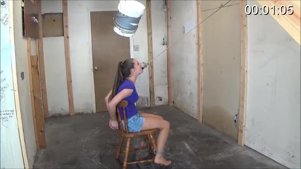 Nichole's predicament  Fun loving Nichole is chair tied under a bucket of cold water. I have it rigged up for release if...or should I say when she lets goof trigger rope clenched in her teeth....Nichole is not showing any signs of letting go, I walk in and add more water to the bucket. I also use a bamboo pole to tickle and poke her from off camera.....Finally she lets go. But she has managed to move her chair just enough not to get the full bucket load. So it is time to do it over.Again Nichole is put back in place with an even colder bucket of water.<br><br><span style='color:#b0b0b0;'>[隐藏文字，购买后可见]</span>