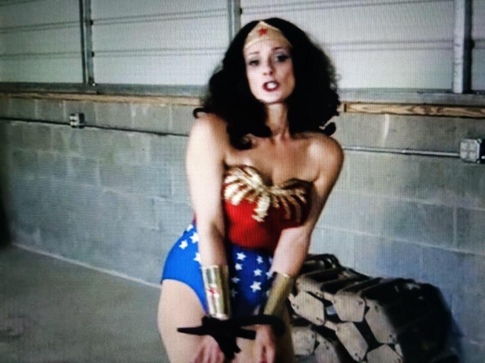 WW vs. the Crimson Glove (Part 2) From: Good Girl Productions<br>Description:<br><br>Season 1, Episode 12<br>starring JENNIFER BLAZE as Wondrous Woman and WILLY DIAMOND as the Crimson Glove<br><br>WW's thirty vicious blows against Crimson Glove's face, chest, legs, and arms deliver no pain whatsoever and amuse rather than frighten him.<br><br>Wondrous Woman, exhausted after the lengthy attack, wonders how much punishment this supervillain can take as she slams the Crimson Glove against the wall and leans against him, panting. This was the opportunity the Crimson Glove was waiting for, as he wants the amazon princess fatigued and mentally unfocused. Grabbing her wrists and hoisting her arms up in the air in a AOH (arms over head) position, he whirls the struggling superheroine around so that she is facing him directly. As the exhausted WW struggles to get free from her dangling position, Crimson Glove sends in his minion, Biff, to rush in and snatch away WW's golden belt of power, the source of her superhuman powers and strength. With her arms pinned, Diana can't keep her belt secured and in one swift snatch her magical power item is yanked from around her trim waistline! Now, with her powers gone, Crimson Glove bearhugs WW and pins her tight. Without her super-strength, there is little that Wondrous Woman can do while being held by her captor, and she soon deduces that the first confrontation against the towering supervillain was to get her to reveal her own Achille's heel so that this attack would succeed!<br><br>Now caught (but never helpless), WW stomps down HARD on the foot of the mammoth villain, giving her a momentary chance to get free of the Crimson Glove's vice-like grip! Still depowered, WW runs over to a junk-filled crate and desperately looks for anything which could be used as a weapon. Finding an old crowbar, she viciously attacks the towering terror, smashing him in the face and chest over a dozen times with the weighty weapon, staggering him to the point of near-victory. Sadly, without superhuman strength her blows lack enough power to damage or destroy his titanium-steel cyborg circuitry and the Crimson Glove quickly takes the crowbar from the powerless princess from paradise! As WW tries to run past him and dash for the door, he uses the crowbar like a hook and snags her in the crotch, pulling her backwards towards him with sadistic glee in his eyes. As Crimson Glove pulls her in tight, WW struggles but because he's hooked her by her lady-parts, she can't wrench free without doing massive damage to her groin. Defeated, WW is effortlessly reeled in and in a supreme display of strength the Crimson Glove bends the steel crowbar into makeshift handcuffs for our sexy superheroine, tightly binding her wrists together! In addition, he also confiscates her golden bracelets, taking the indestructible wristbands for himself and leaving the sobbing WW defenseless against gunfire. He also takes WW's red and white boots and mentions that with the area heavily mined with caltrops she won't be able to run away anymore.<br>When we look in on Wondrous Woman the next day, we see that she's been shrinkwrapped and is ready for delivery to some faraway distant land. As WW struggles to break free, she finds that she doesn't have enough strength in her powerless condition to get through all of the thick mummification wrap. After a few minutes of helplessly twisting and turning, the Crimson Glove arrives and with one flex of his bionic muscles he rips a small hole in the crotch region of WW's cocoon wrap and inserts a purple Hitachi vibrator. Taping it down so that it cannot be removed, he activates it and leaves WW to deal with the soothing vibrations coming from the massage tool. Wondrous Woman does her best to resist the pulsing vibrations, trying hard to not get excited, but the powerful pulses soon trigger her dormant (and repressed) sexual urges and soon WW reaches sexual climax and explodes with repressed sexual ecstasy! As she cums into her costume, she can feel a second and a third orgasm coming, and although she mentally tries to control her body the feelings are too strong and she cums several more times as well, making the inside of her saran-wrap cocoon hot and damp! As Wondrous Woman takes shame in her humiliation the worst is yet to come when she finally goes down and doesn't come back up.<br><br>When WW comes to later she realizes that her power belt is back on but now she's ballgagged and she's trapped in a nylon womb! Worse, she realizes to her horror that the nylon womb she's trapped in is actually her own indestructible amazonian pantyhose (which is indestructible like the rest of her costume) and that the villains pulled them off of her while she was resting and are now using them as their instrument of revenge against her as a tool of bondage! The womb (now soaked in some noxious substance) keeps her feeling dizzy and unfocused, and so even with her super-strength it proves to be worthless as she can't marshal the drive needed to escape from her confinement! The barefooted superheroine (now that they've taken her pantyhose from her) struggles in her own nylons as the villains decide to ship her off. Fearing her accidentally hurting herself with the gag on, they unbuckle it from around WW's face. Picking her up and carrying her OTS (over the shoulder) to the waiting car, the feeble WW swears that they'll never get away with this and so after placing her in the trunk the two leering criminals agree to give her an "old fashioned Faustaesque takedown" using their tried-and-true swatch of fabric soaked in something decidedly sinister! Clamping the fabric down into place over WW's sniffer and cakehole (and using multiple takes by the camera) the protesting Amazon is defeated and sent to sleepy-time land over her angry and protesting objections! Merciful Minerva? Is this really the end for America's greatest champion and do-gooder? Tune in, and find out!<br>购买链接<span style='color:#b0b0b0;'>[隐藏文字，购买后可见]</span><br>