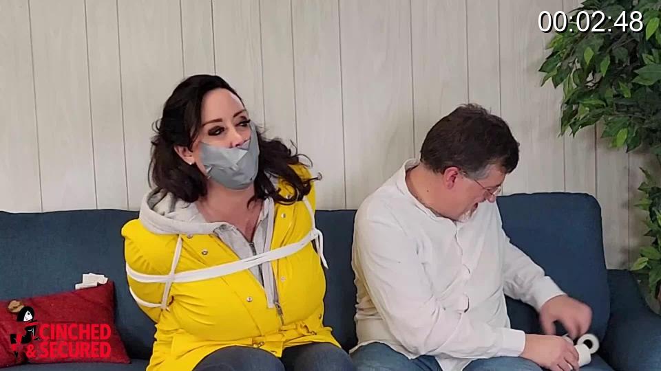 Christina Carter - The Triple Gag Challenge Christina Carter is always up for a good challenge IF she trusts the challenger! Today she visited me in tight jeans, boots and a reversible raincoat to take the triple gag challenge! The rules are simple: I tie her up, stuff her mouth to bursting with handkerchiefs, seal it shut with tape, and then wrap her head tightly until only her eyes and nose are left visible, and then she has to make herself heard! Of course, every time I do manage to make out what she is saying, her gag becomes more intense! By the end of the challenge, her head has been completely wrapped not once, not twice, but THREE times using vet wrap, vinyl tape and electrical tape! Now that I am convinced she is well and truly gagged, she learns the real challenge of this little game: escaping from a tight tape hogtie! Yes, Christina is always up for a good challenge from someone she trusts...too bad she put her trust in the wrong man!<br><br><span style='color:#b0b0b0;'>[隐藏文字，购买后可见]</span>