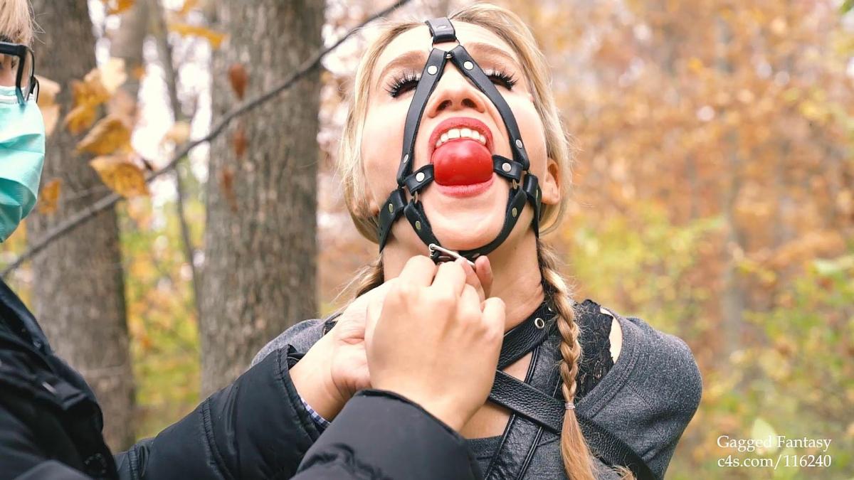 Blair Blouson Fall Color Stroll in Bondage Scene 1: Bondage enthusiast Blair enjoys taking a stroll outdoors in the back county whenever free. One day she had a wild idea: How fun would it be to actually be tied up and gagged in the woods. Hence, she goes to the woods in an armbinder and body harness, and later a harness gag. she strolls around a enjoys the private kinky experience. (~6min)<br><br>Scene 2: Next, she switches gears and applies a panel gag, and handcuffs herself behind the back. She again strolls the woods and enjoys the unique moment. (~10min)<br><br>Scene 3: Switches to a gas mask (~5min)<br><br>Scene 4: Self mesmerizing with lambskin blindfold and harness gag (~2min)