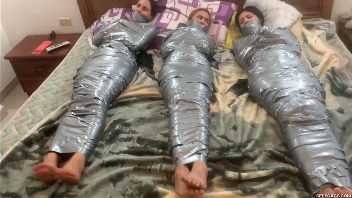 Mary, Laika &amp; Khloe in The Cursed Egyptian Amulet Turned All Three Friends Into Barefoot Wrapped Three bored girlfriends are in for an unexpected funtime together as an ancient Egyptian amulet draws each of them to it and magically transforms them into barefoot duct-tape entangled and tightly tape wrap gagged mummies!<br><br>Included in this clip: mummification, tape bondage, latinas, transformation, duct tape wrap gagged, gaggedgirls, struggling, damsel, tape gagged, gagtalk, stuck, bdsm, barefoot, foot fetish, gagged girl fetish