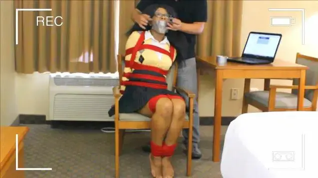 College Cutie Captured! As if college isn't hard enough! Cupcake is caught and placed in a strange room, tied in a chair! She begs to be released but her captor enjoys watching her struggle and squirm against the tight rope. With her ankles, tits, and arms bound, she's helpless! The captor wraps her mouth with duct tape, and then leaves her to squirm some more!<br><br>