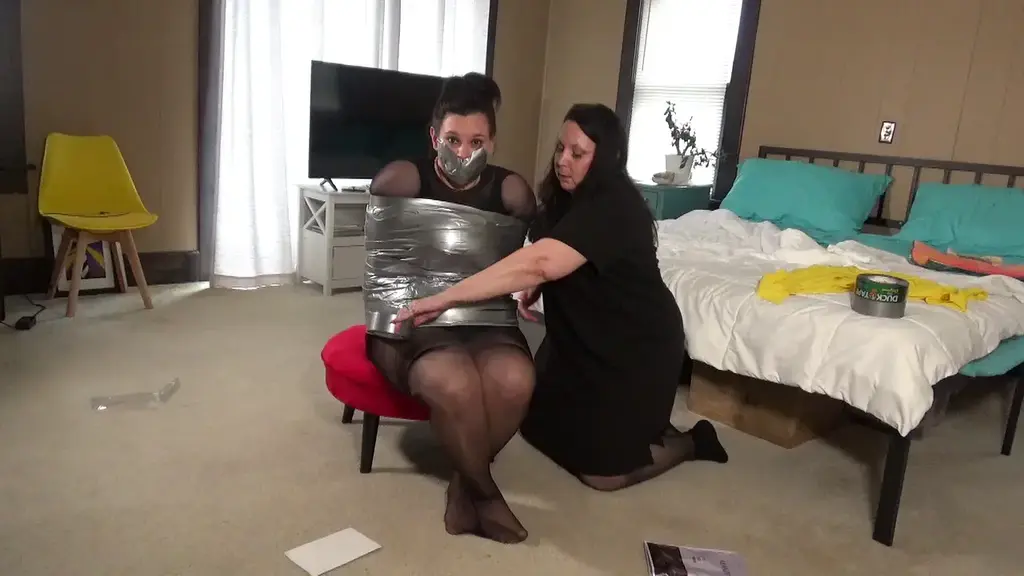 Now you can smell my ass, pussy, and feet all at the same time! Gina breaks into Courtney's house and hits her over the head with a vase. When Courtney wakes up, she is encased in pantyhose. Gina takes off a sock and uses it to gag courtney, then mummifies her in shiny silver duct tape. Courtney is left to struggle while Gina ramsacks her house, finding credit cards, money and jewelry. She returns and removes her well-worn stocking and puts them over Courtney's face placing the cotton crotch panel right over Courtney's nose. Gina leaves after reminding Courtney that it may be some time before she is found.