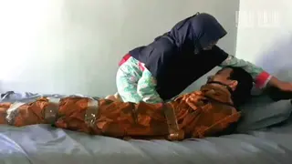 An Indonesian Man Tied Up With Duct Tape And Wrapped In Cloth An Indonesian man was tied up with duct tape and wrapped in cloth. Then tied up and the man struggled until he was released.