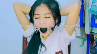 Indonesia Schoolgirl Bondage ID-BOUND026 Indonesia Schoolgirl Bondage with rope and he mouth gagged