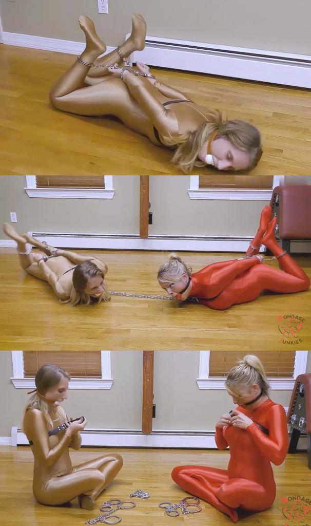 Bella &amp; Piper vs. Their High Stakes 贝拉无法决定轮到谁被绑，于是提议玩个游戏来决定。规则很简单：两个女孩把自己绑起来，然后把钥匙分别扔到房间的两侧。一旦手铐卡入，她们就无法逃脱，直到其中一人拿到钥匙。这从一开始就是一场拉锯战，她们都知道，无论谁赢了，都不会轻易放过对方。<br><br>贝拉和派珀在地板上拉扯、扭动、打斗，很快就精疲力竭。即使是她们的紧身连衣裤也对她们不利，在光滑的木地板上毫无优势。如果她们不小心，好胜的本性可能会让她们陷入最糟糕的境地：僵局。Unable to decide whose turn it was to get tied up, Bella suggests a game to settle it. The rules are simple: both girls hogtie themselves and toss a key for each of them to opposite sides of the room. Once the handcuffs click into place, there's no escape for either of them until one of them can get to a key. It's a tug of war from the start, and they both know that whoever wins won't be letting the other free anytime soon.<br><br>As Bella and Piper pull, twist, and fight across the floor, exhaustion quickly sets in. Even their catsuits work against them, offering no leverage on the slick wood floor. If they're not careful, their competitive nature might land them in the worst situation of all. Stalemate.