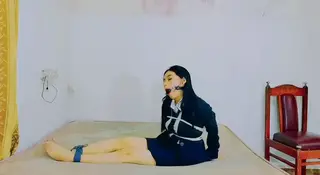 An Indonesian Girl Does Self Bondage (ID-BOUND043) An Indonesian Girl Performs Self Bondage in a Room on a Bed Without Any Help