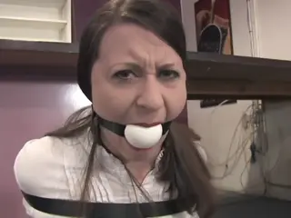 d2506SERENE-All belted up and ball gagged Serene is lured to an abandoned building by a man and when she gets there, she thinks it's a joke. That is until she finds herself bound and in leather straps with a huge ball gag shoved in her mouth